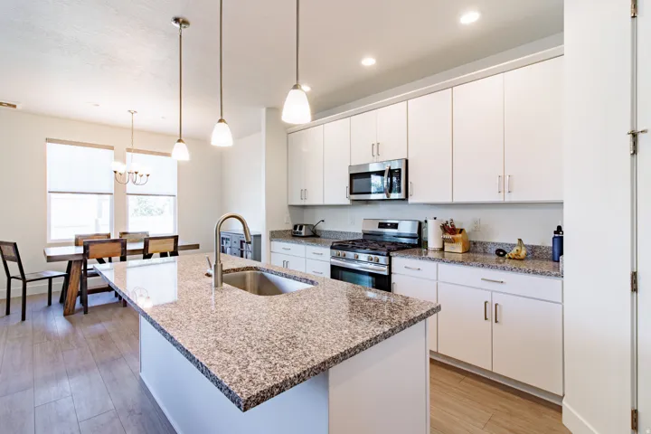 Kitchen island with granite countertop and undermount sink