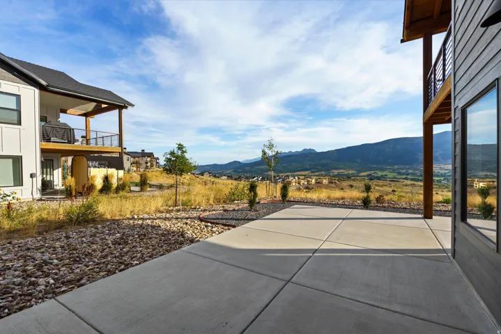 Poured concrete patio with a mountain backdrop