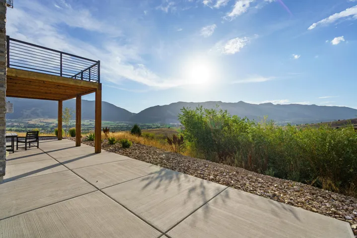 Upper-level deck with black horizontal bar railing