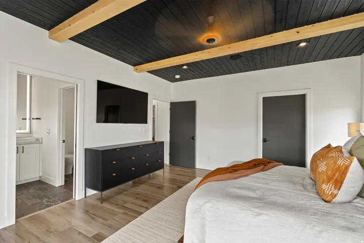 Wood-finish flooring with a textured area rug