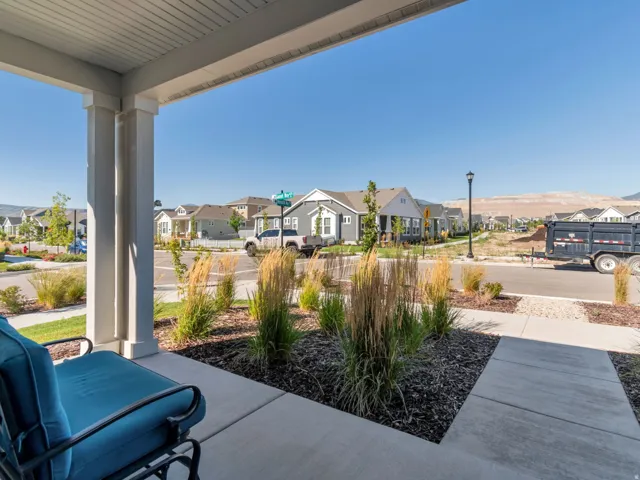 Sitting on the front porch. Open Green Space will be finished across the street.