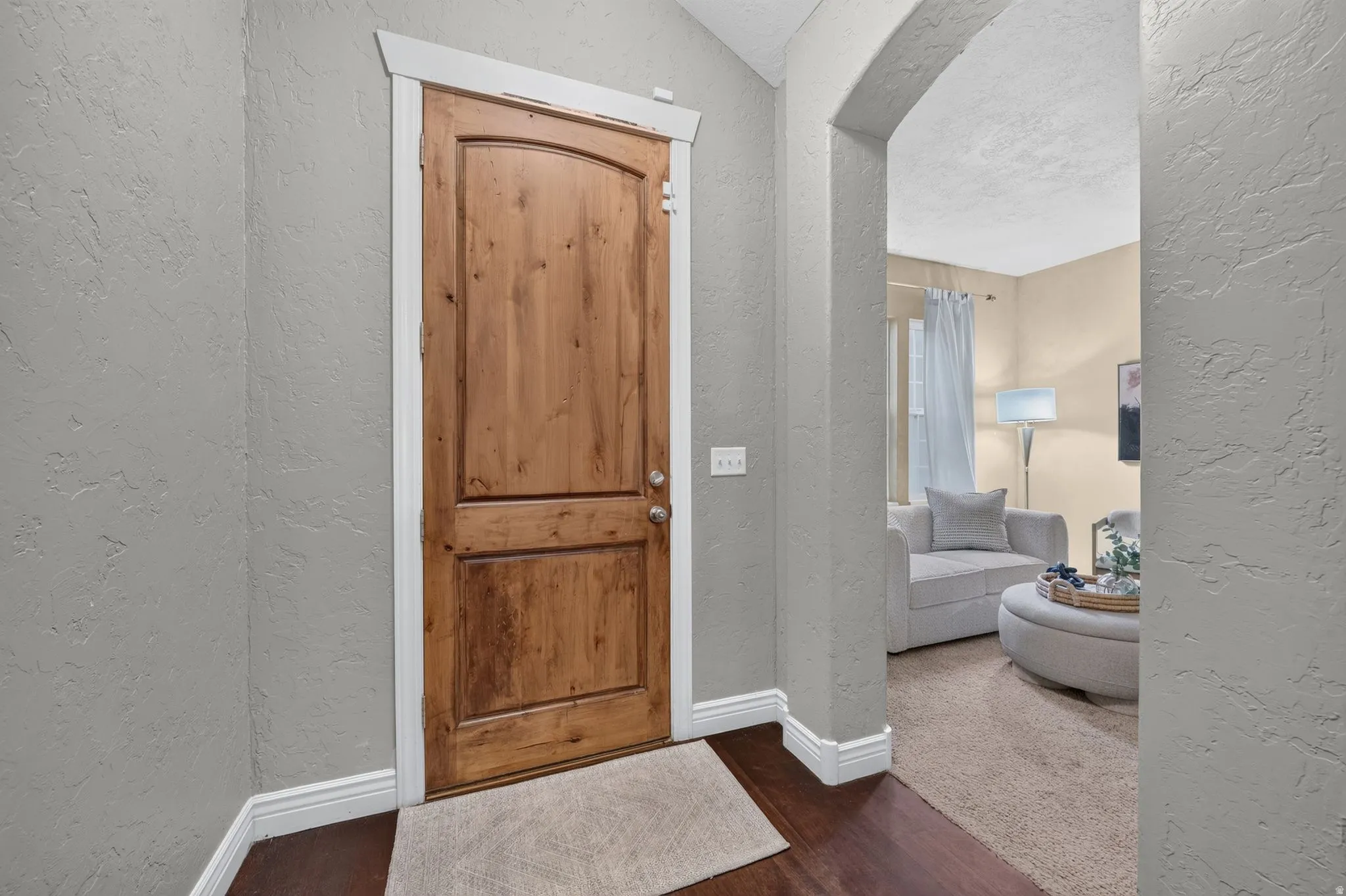 Solid wood entry door with white trim