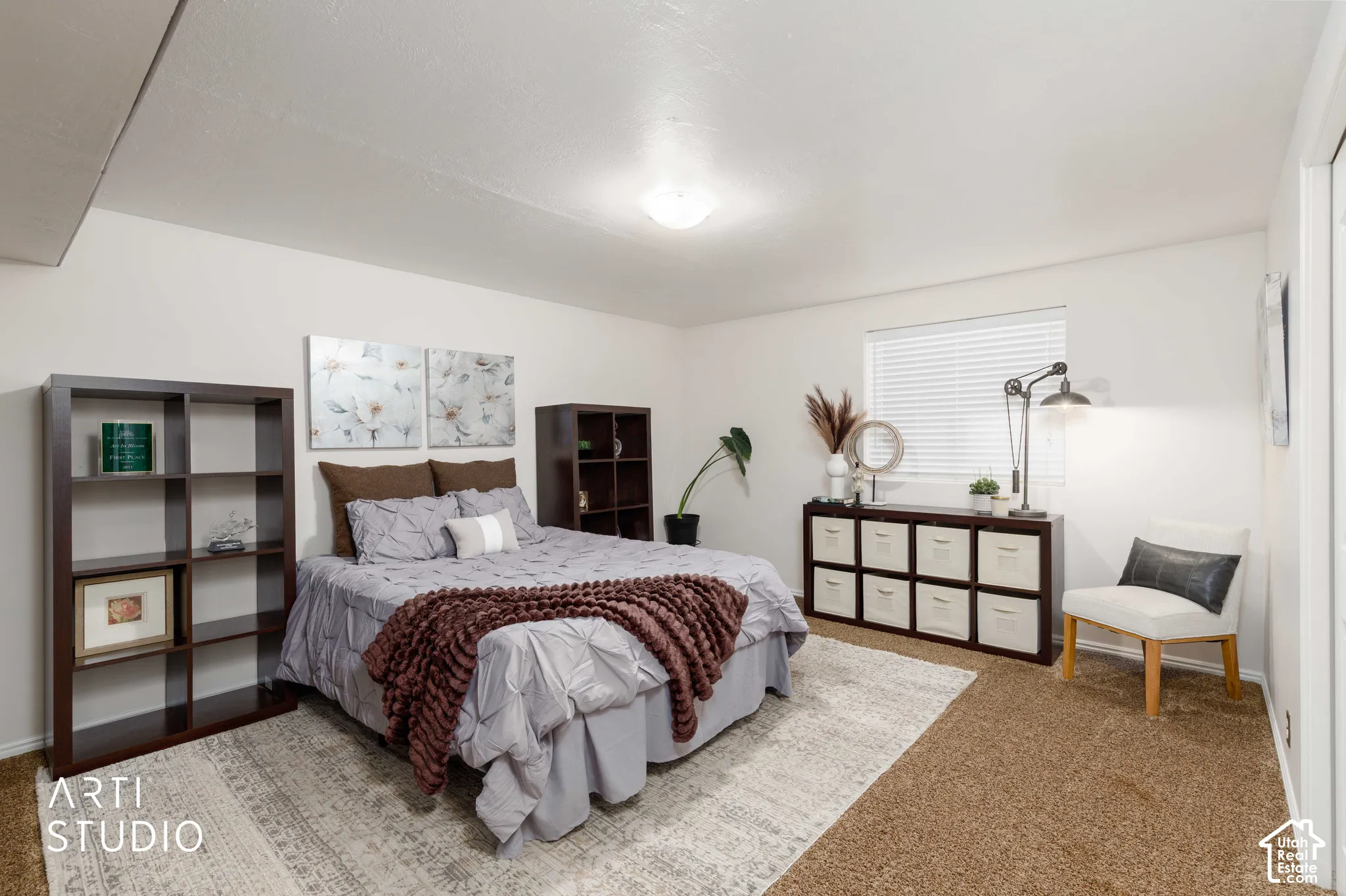Bedroom #5 Large room with brown accent wall, bifold closet doors, brown carpet and window with white blinds