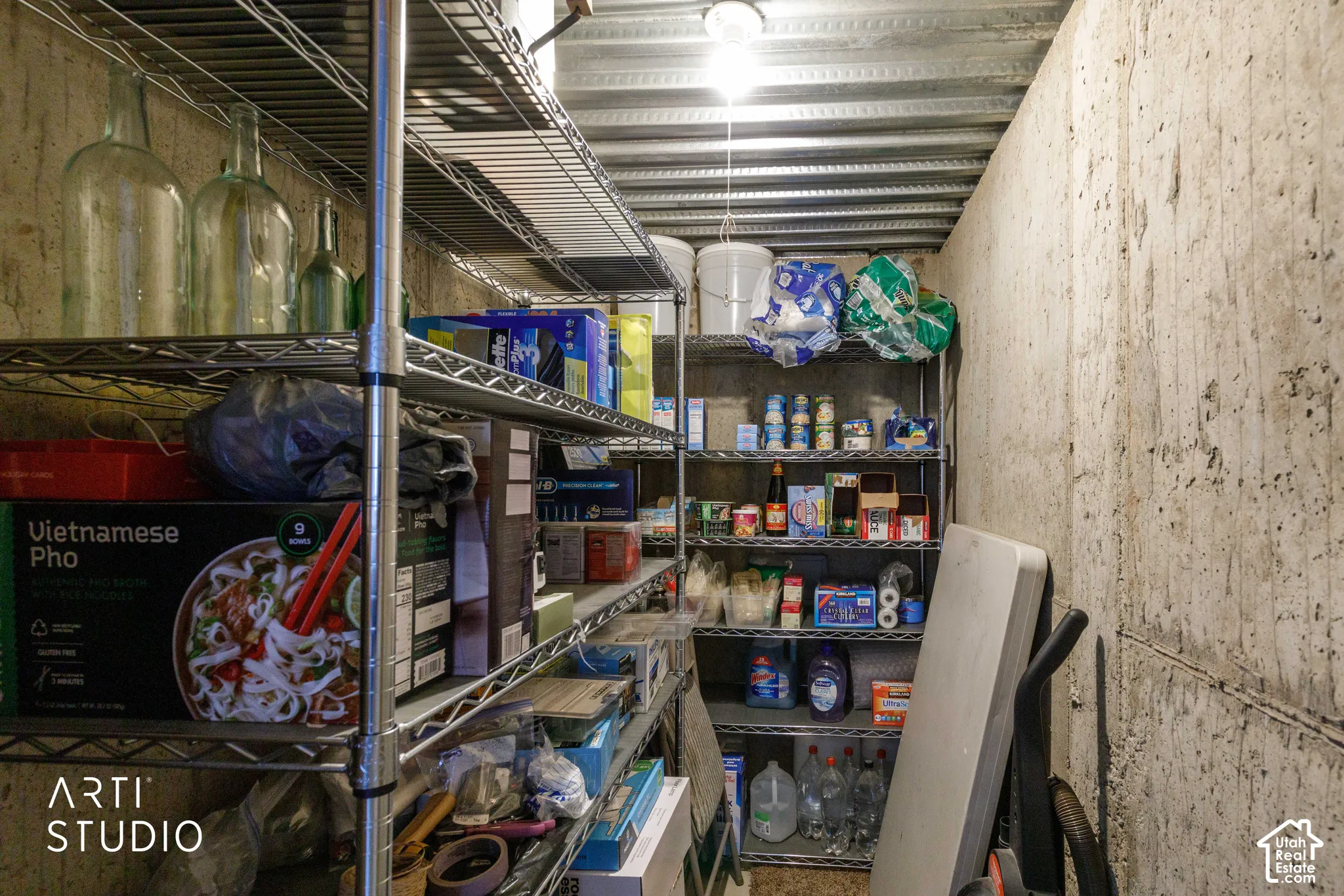 Cold Storage room located in basement next to family room, comes with wire shelves.