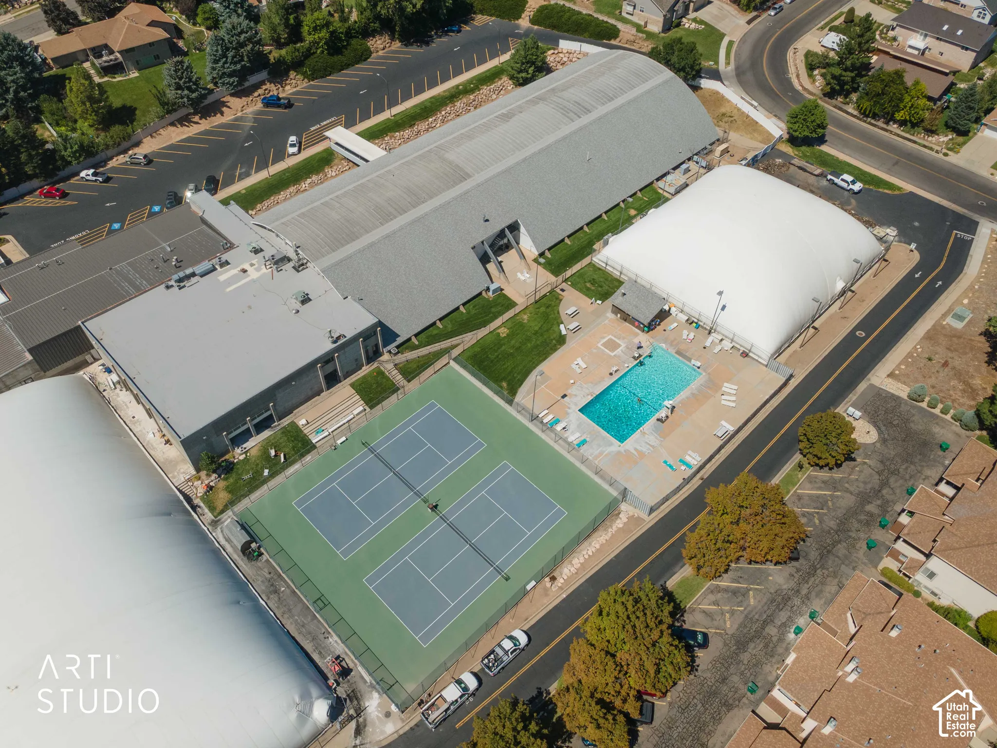 The Athletic Club has Outdoor tennis courts, swimming pool, large parking area, as well as indoor club activities and training areas.