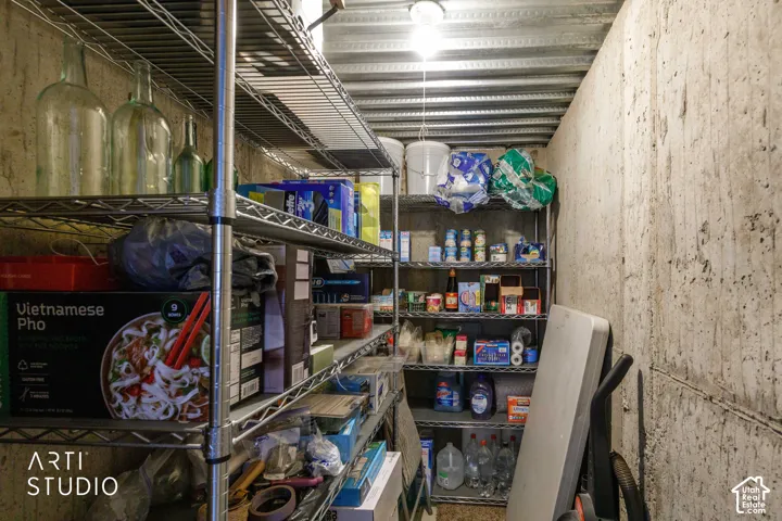 Cold Storage room located in basement next to family room, comes with wire shelves.