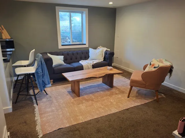 Recessed lighting, neutral wall tones, and carpet flooring
