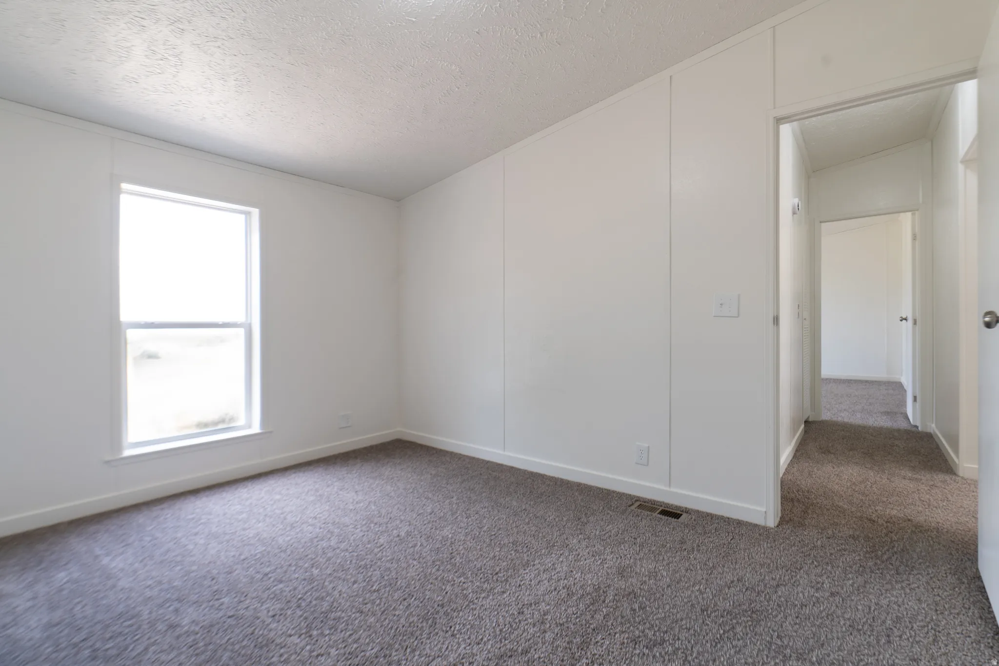 Neutral wall color with a window providing ambient light