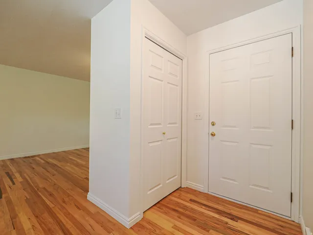 Hardwood flooring, painted interior doors, and neutral wall tones