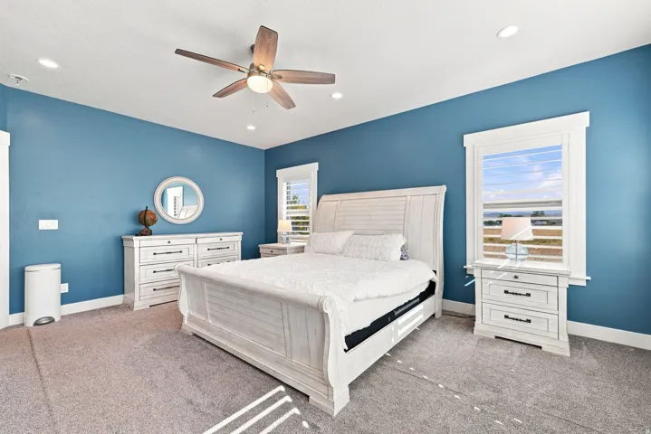 Recessed lighting, ceiling fan, and carpet flooring