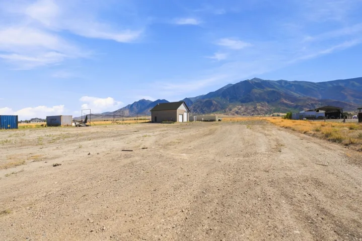 Expansive gravel lot with a detached structure