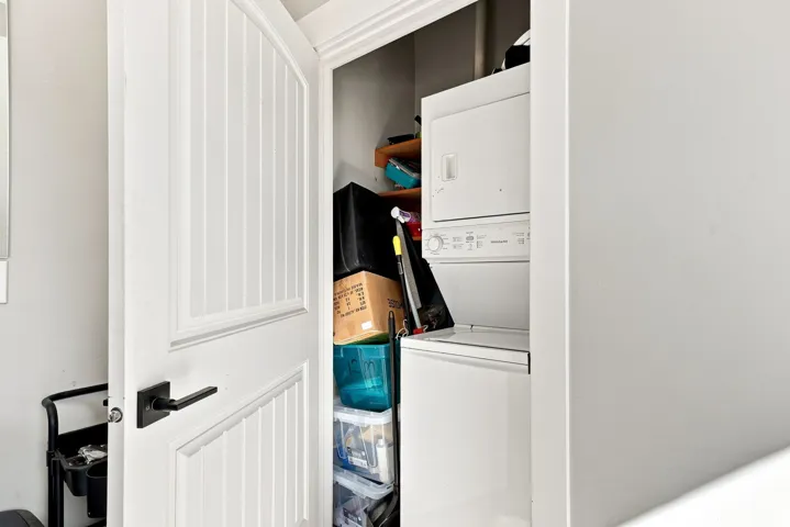 White stacked washer and dryer unit