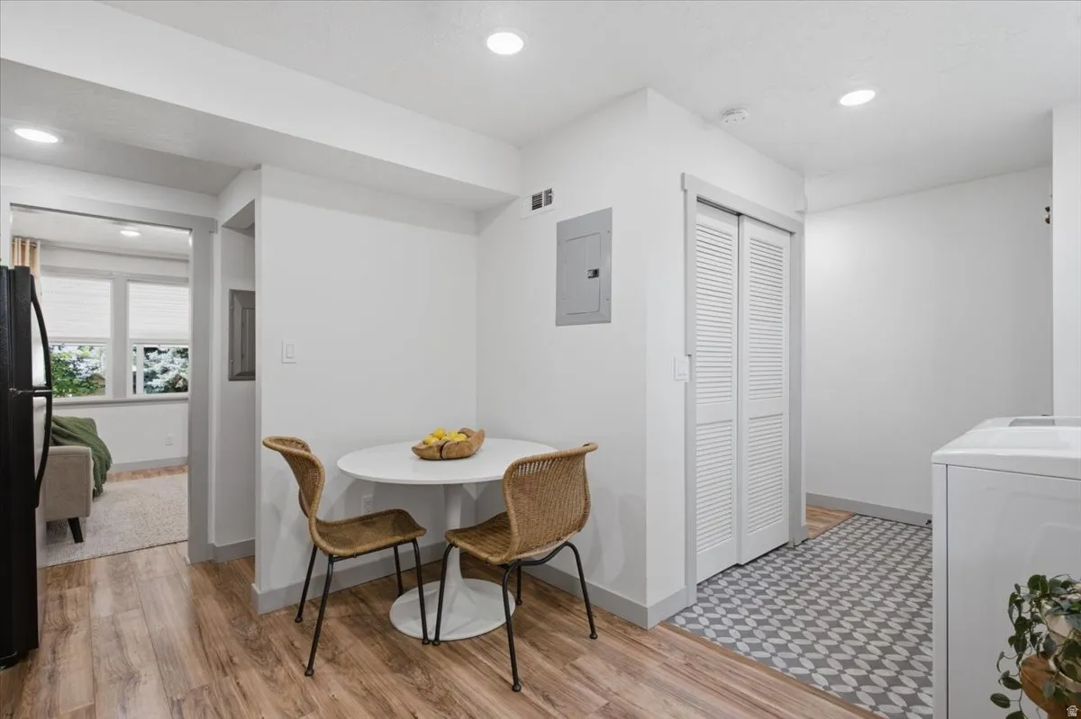 Laminate wood-finish flooring, recessed lighting, bi-fold closet doors