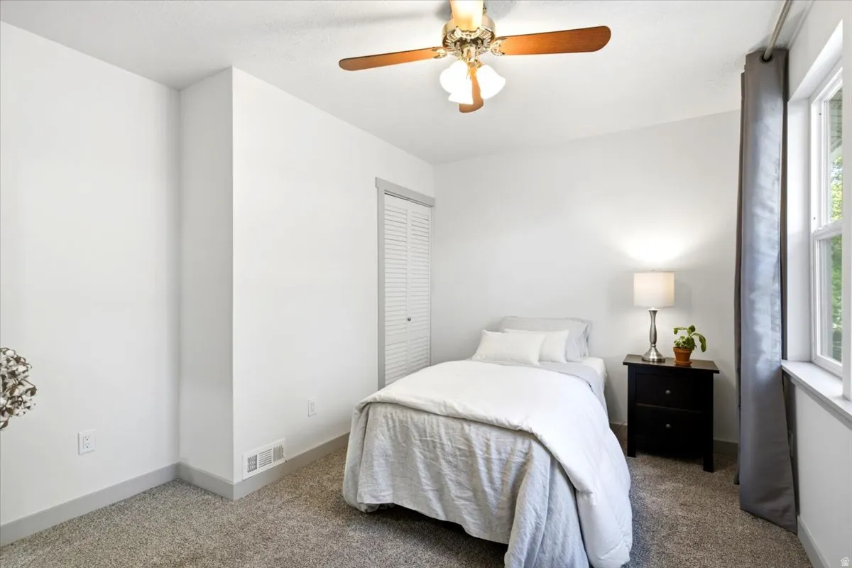 White walls with a contrasting gray baseboard and carpet