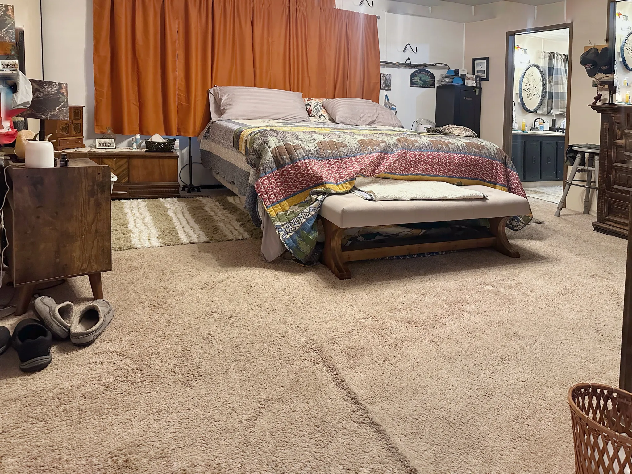 Carpeted flooring extending through the room