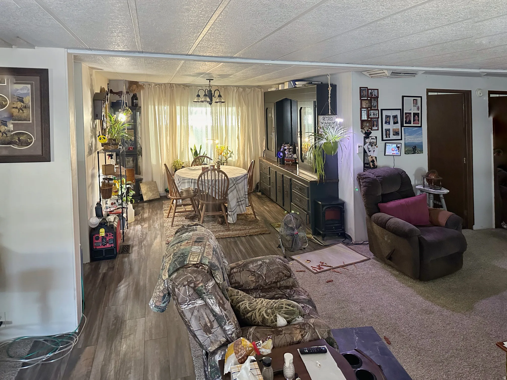 Additional contentThe image shows a residential interior with multiple areas visible simultaneously, but the primary subjects—furnishings, area rugs, artwork, and decorative items—are removable elements that cannot be included in the caption