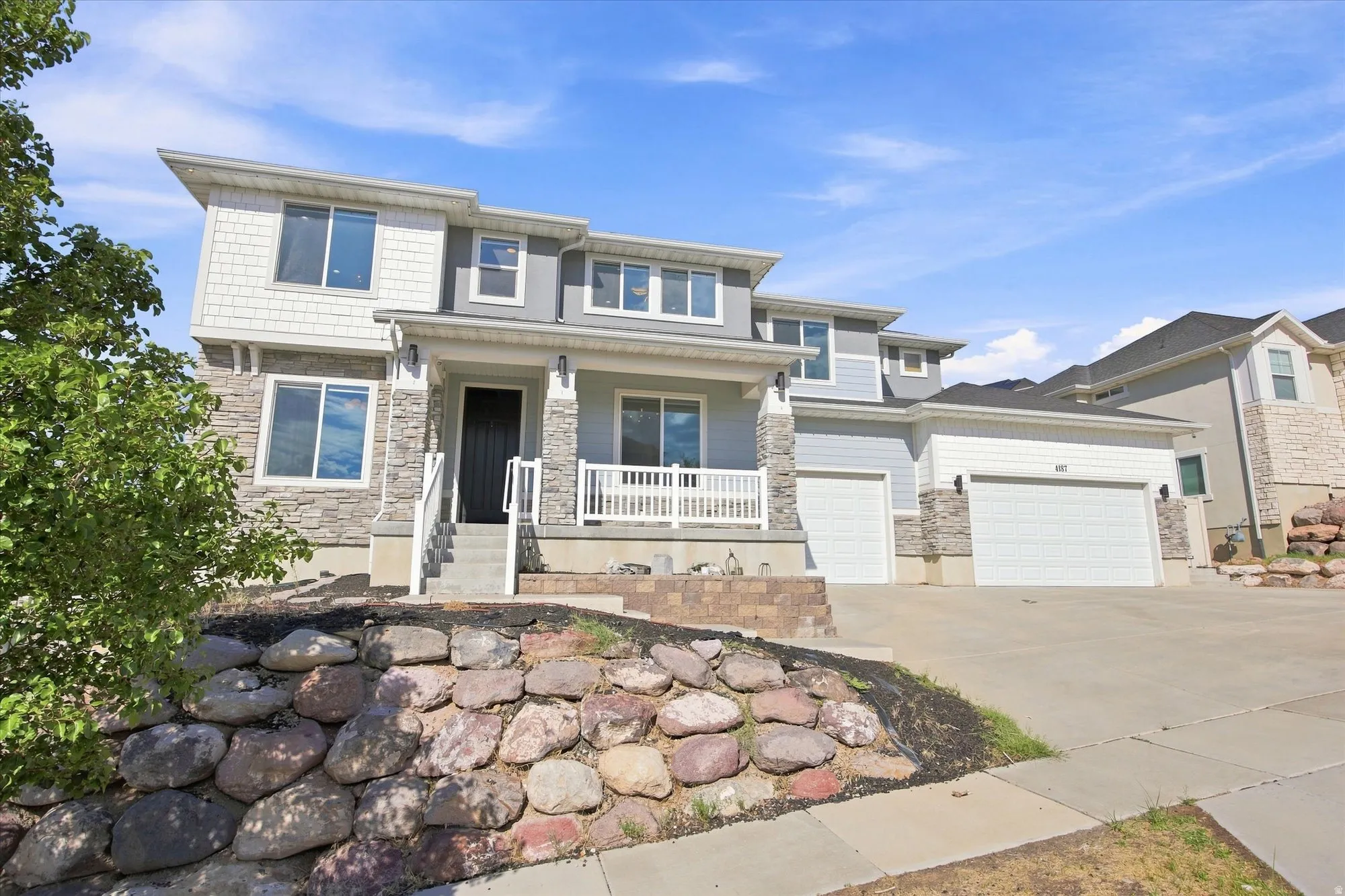 Modern exterior with stone accents and horizontal siding