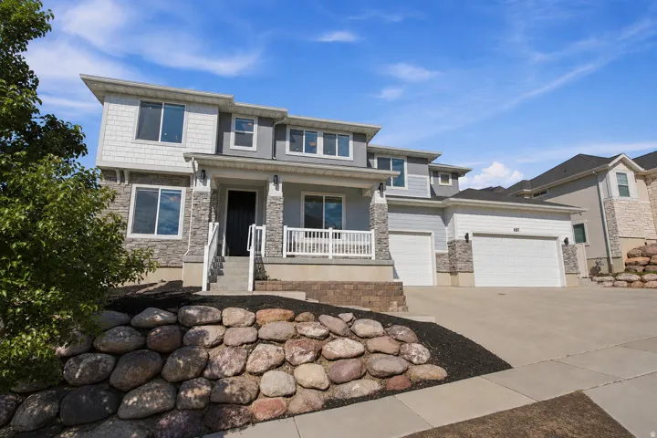 Modern exterior with stone accents and horizontal siding