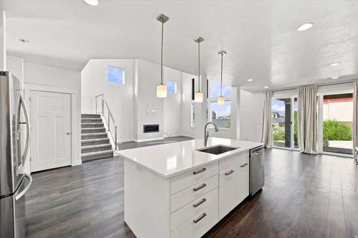 Open-concept living area with dark wood-finish flooring