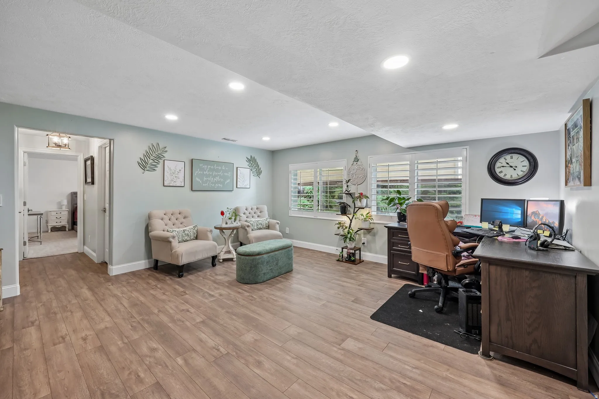Wood-finish flooring throughout, recessed lighting, and window shutters