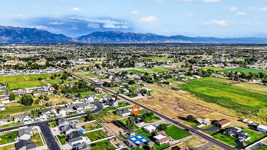 Residential area with established landscaping and mountain backdrop