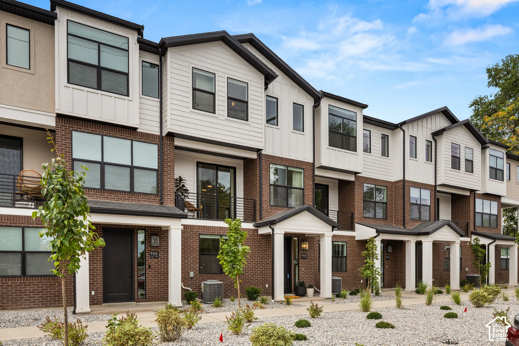 Contemporary exterior architecture with brick and vertical siding accents