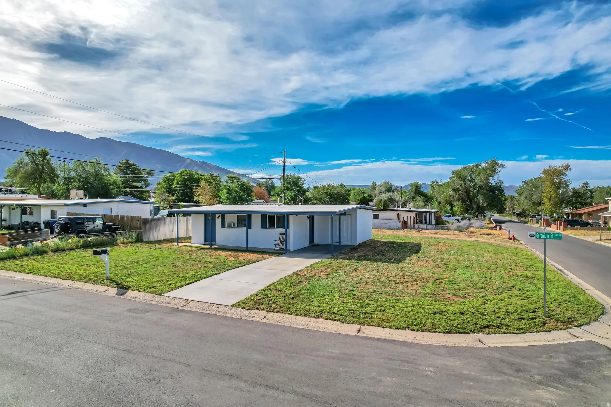 Single-story residence with a covered entryway and a concrete driveway