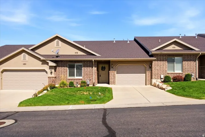 Two-car garage with concrete driveway