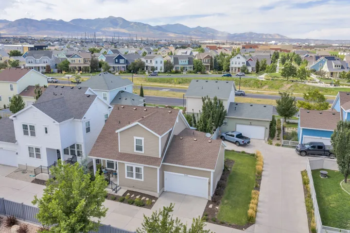 Aerial perspective showcasing a residential neighborhood with distant mountain scenery