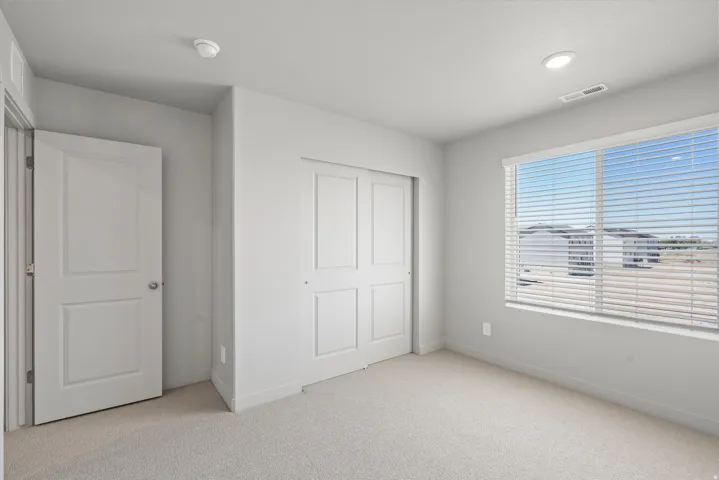 **Disclaimer** Interior package has upgrades not photographed.  Recessed lighting, light-toned carpeting, window blinds, and white interior doors