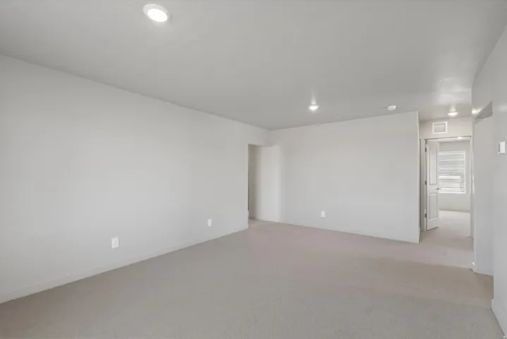 **Disclaimer** Interior package has upgrades not photographed.  Recessed lighting, neutral wall paint, light-toned carpeting, and a doorway