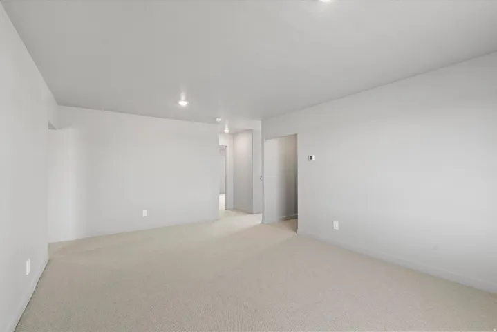 **Disclaimer** Interior package has upgrades not photographed.  Recessed lighting and neutral wall tones complement the light-toned carpeting throughout