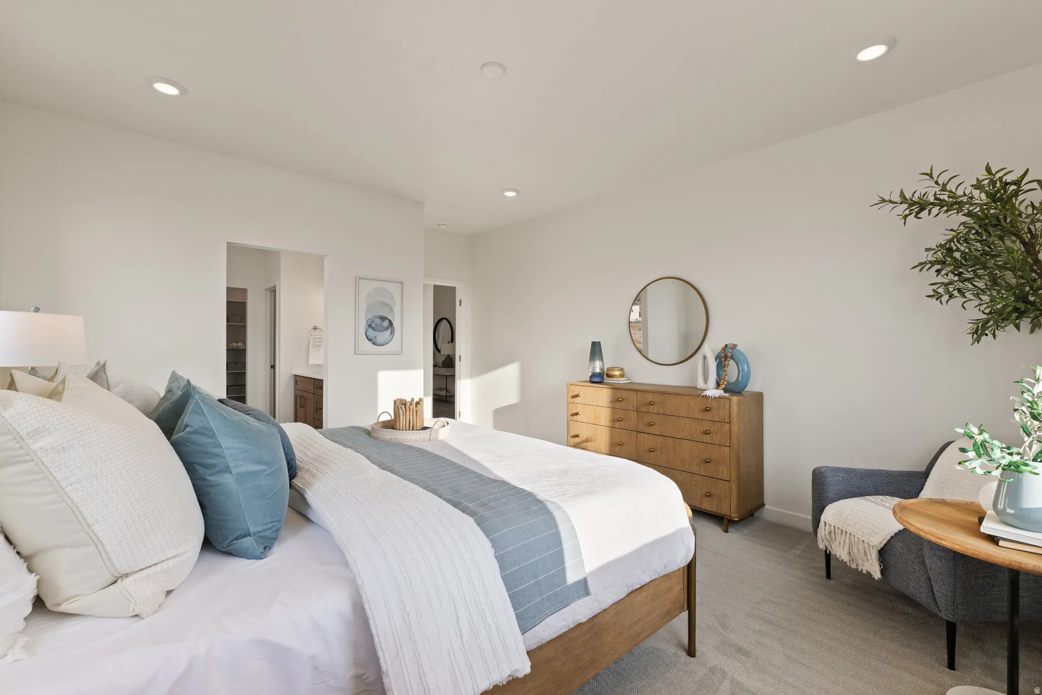Recessed ceiling lighting, light-toned carpeting, ample wall space, and interior doorways