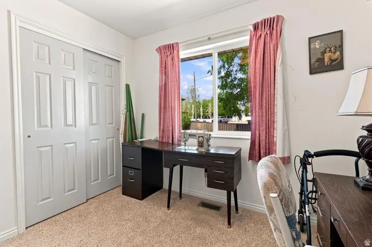 Wall-to-wall carpeting and white walls