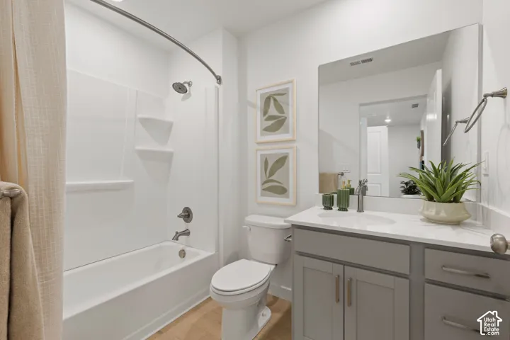 White tub and shower combination with a curved shower rod