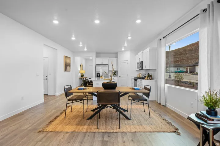 Open-concept living space with wood-finish flooring