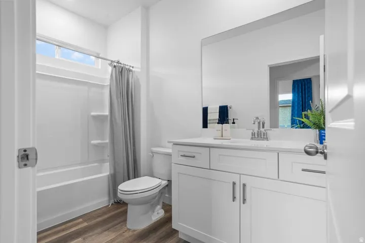 White vanity with an integrated sink and chrome fixtures