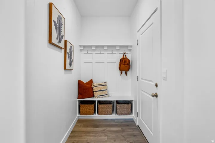 Built-in bench with integrated cubby storage, complete with coat hooks and paneling