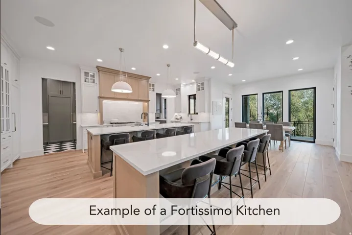 Expansive kitchen and dining area featuring light wood-finish flooring, recessed lighting, and a kitchen island with a light-colored countertop