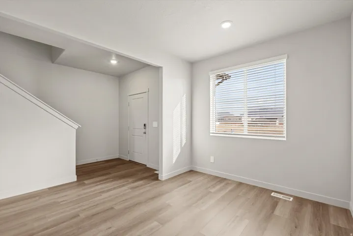 **DISCLAIMER**   Interior package upgrades not photographed. Recessed lighting, wood-finish flooring, white window blinds, white interior door, and white wall paint