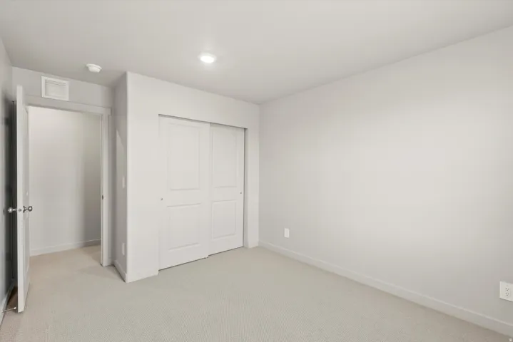 **DISCLAIMER**   Interior package upgrades not photographed. Neutral-toned walls, recessed lighting, and light carpet flooring