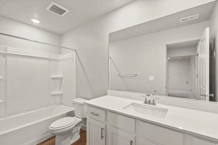 **DISCLAIMER**   Interior package upgrades not photographed. White cabinetry with silver-tone hardware, a white undermount sink, and a chrome faucet
