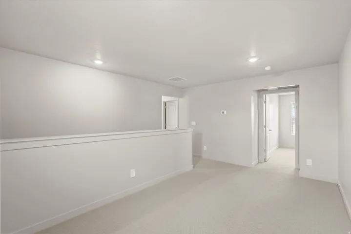 **DISCLAIMER**   Interior package upgrades not photographed. Neutral tone walls, recessed ceiling lighting, light-colored carpeting, and white trim