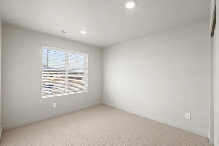 **DISCLAIMER**   Interior package upgrades not photographed. Neutral paint palette, recessed lighting, carpet flooring, window with blinds