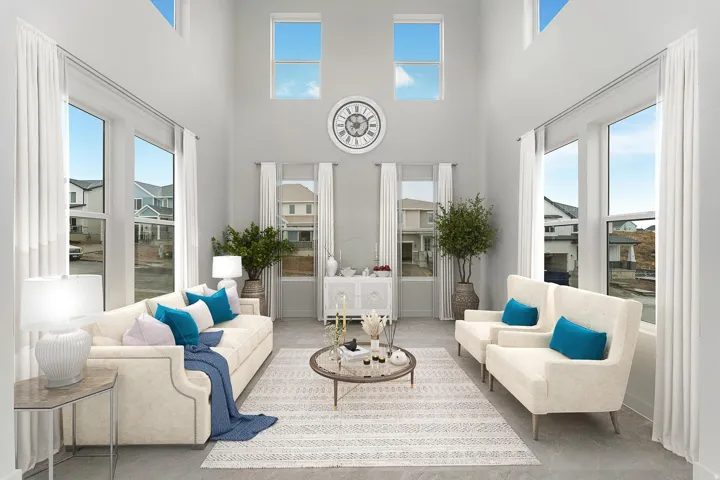 Bright, light-filled living spaces showcasing soaring ceilings with clerestory windows, dual glass French doors opening to exterior spaces, and wide-plank wood-finish flooring throughout