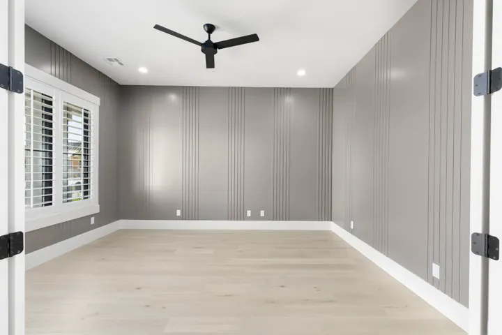 Light wood-finish flooring, recessed lighting, and a modern ceiling fan