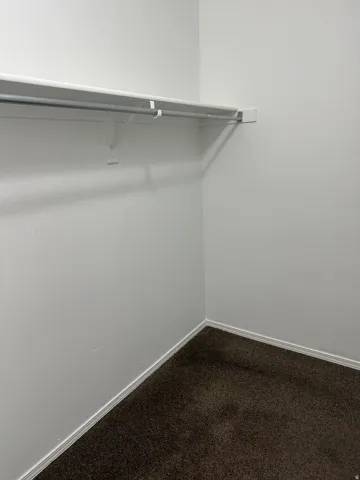 Built-in closet shelving with a hanging rod