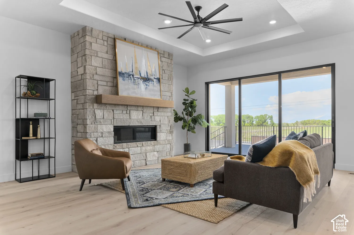 Stone-faced fireplace with a wood mantel