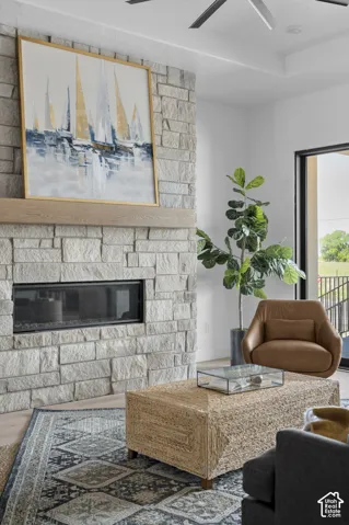 Stone-clad fireplace with a wood mantel and linear firebox