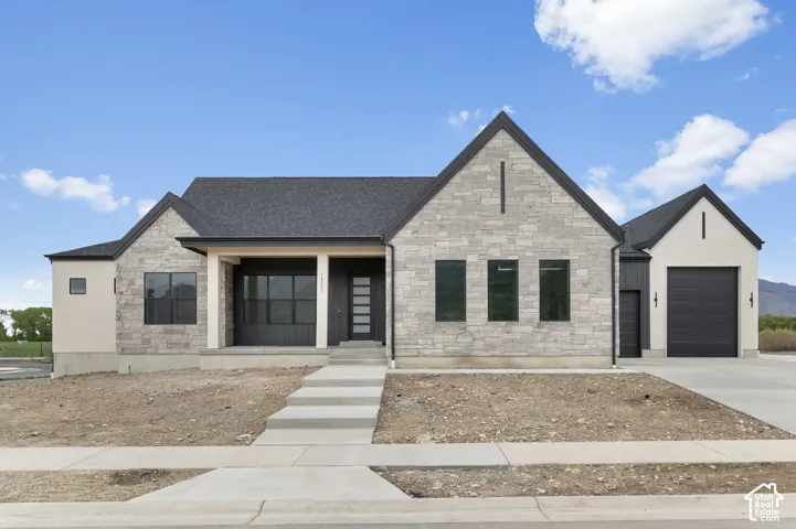 Contemporary exterior featuring stone and stucco finishes